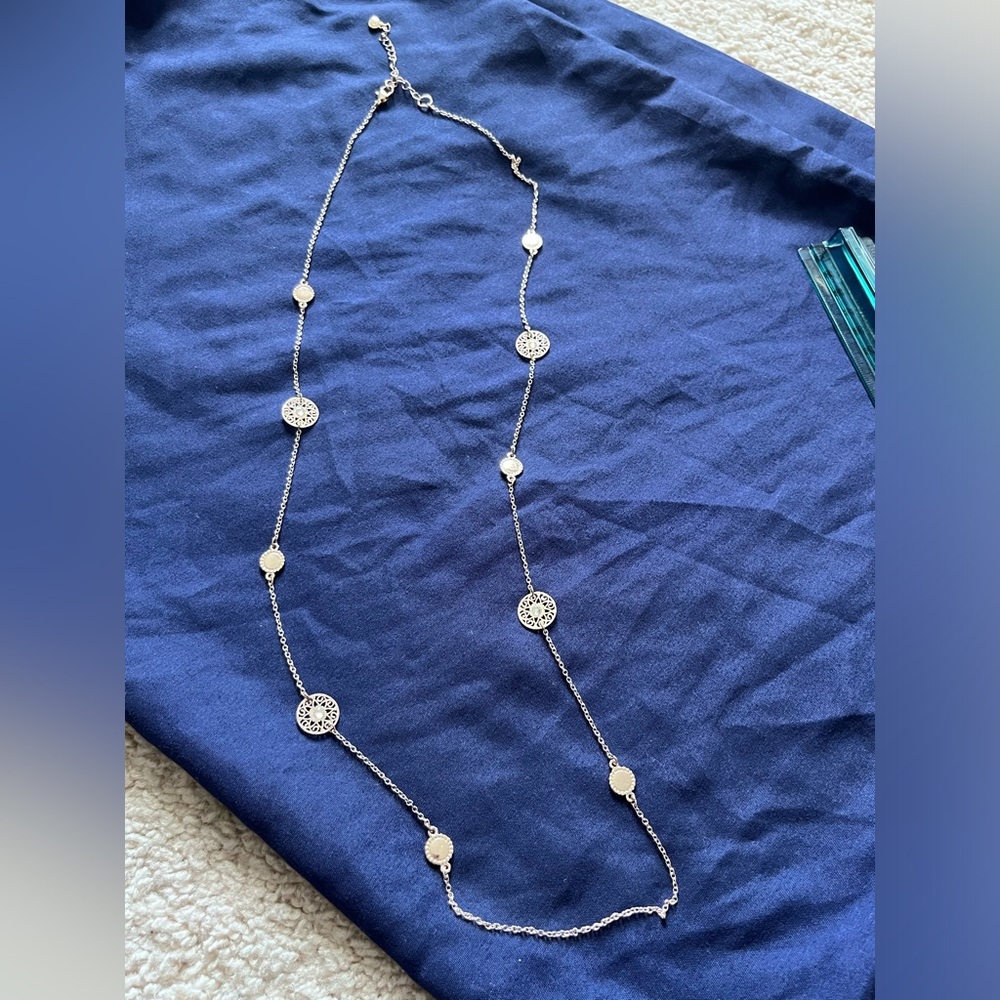 Gold tone long medallion crystal necklace